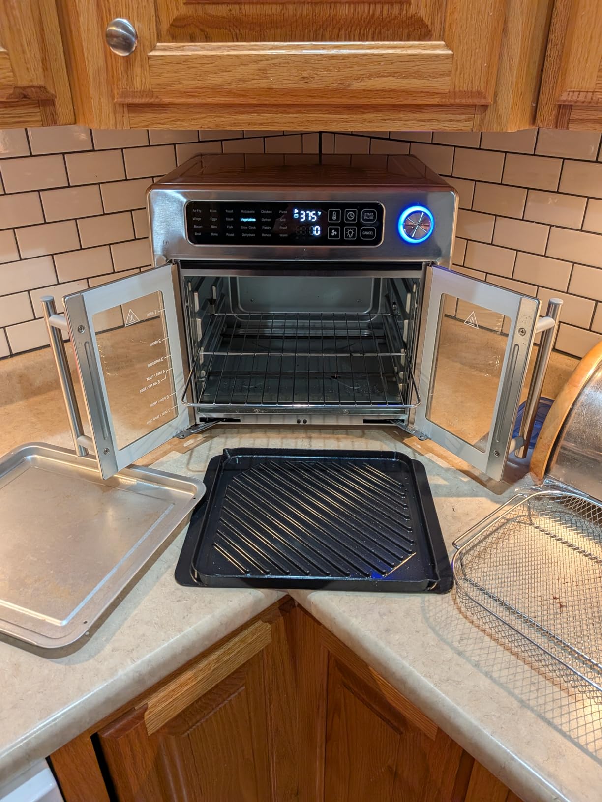 Emeril Lagasse 26QT French Door Multi-Function Air Fryer Toaster Oven | 26QT air fryer oven with French doors, 24 cooking functions, dual-speed fan and rotisserie for easy family meals. customer photo 2