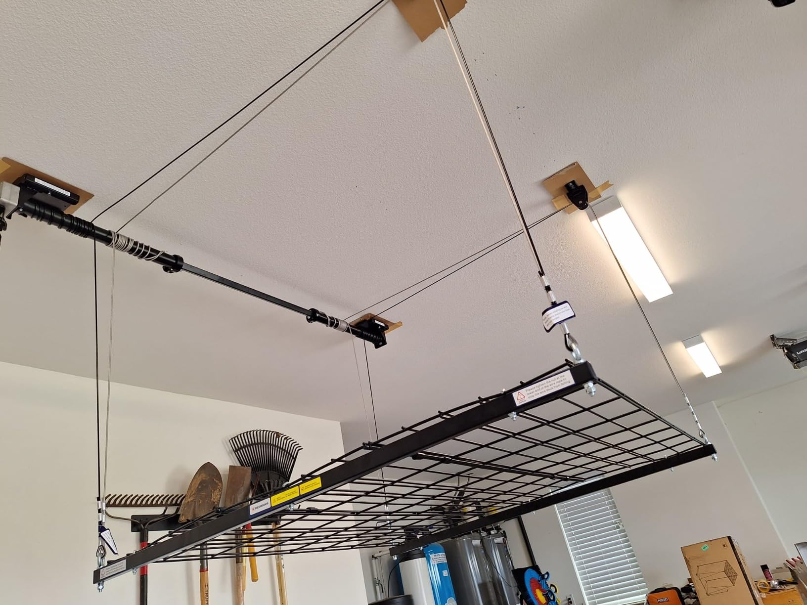 FLEXIMOUNTS GL1 Overhead Garage Lifting Storage Rack, 4x4 Ft Heavy-Duty Metal Garage Ceiling Rack, Adjustable Organization System With 71''L Axle, 350lbs Weight, Black customer photo 1