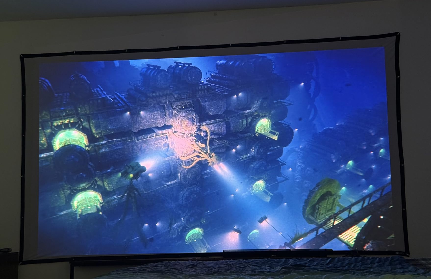 100 inch Projector Screen with Black Backing, Foldable 16:9 | Black-backed polyester screen with straight edges; washable and wrinkle-resistant for home theaters and outdoor movie nights customer photo 1
