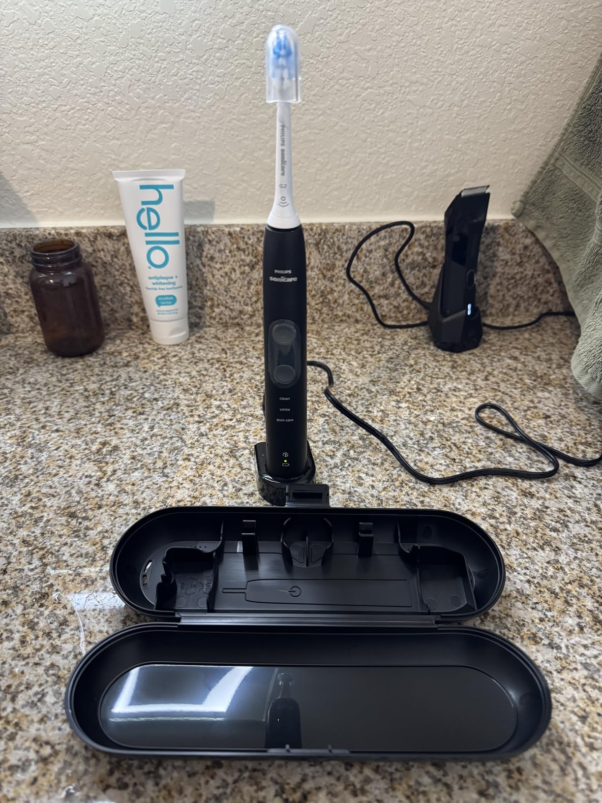 Philips Sonicare 5300 Rechargeable Electric Toothbrush, 3 Brush Head, Black | 700% More Plaque Removal¹, Visual Pressure Sensor, 3 Brush Settings, 14-Day Battery, Travel Case, HX6423/34 customer photo 1