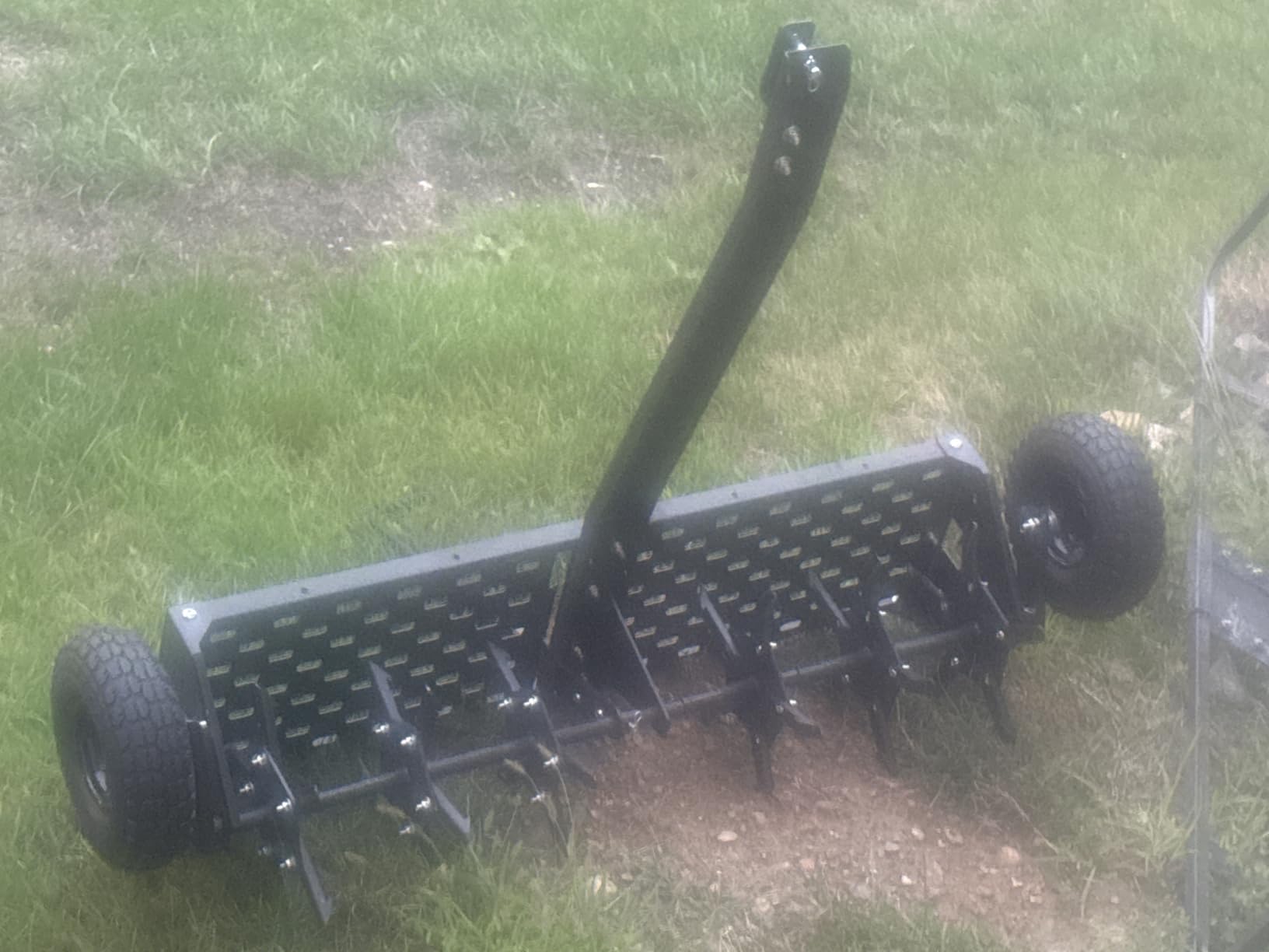 Garvee 48-Inch Tow Behind Plug Aerator,Pull Behind Aerator with Durable Steel Tines Lawn & Tray and Pneumatic Tires Tow Behind Spike Aerator for Lawn, Farm,Planting,Green customer photo 1